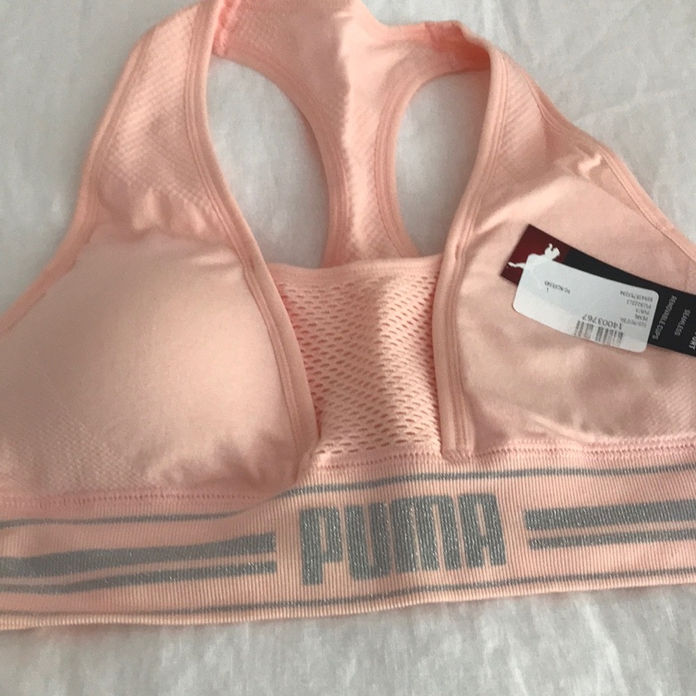 Workout top with built in bra for moderated impact